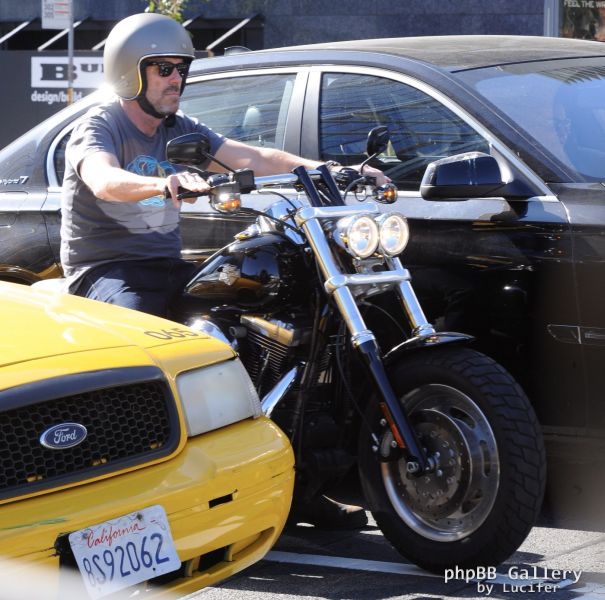 Hugh Laurie - Riding his Harley Davidson along the Sunset Boulevard - March 2012