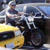 Hugh Laurie - Riding his Harley Davidson along the Sunset Boulevard - March 2012