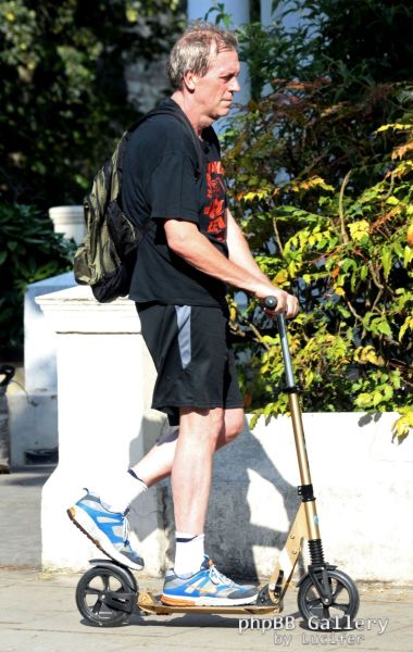 Hugh Laurie on his scooter seen in London July 2018