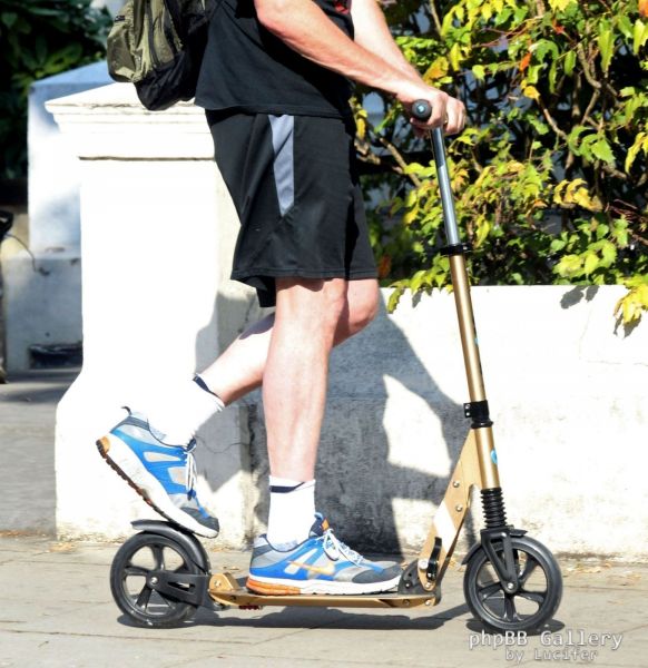Hugh Laurie on his scooter seen in London July 2018