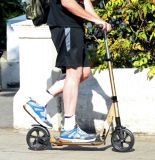 Hugh Laurie on his scooter seen in London July 2018