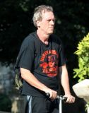 Hugh Laurie on his scooter seen in London July 2018